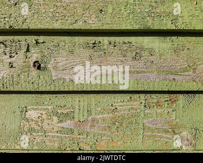 Vintage Holz Hintergrund Textur mit Knoten und Nagellöcher.Alte Grunge Holzplanken. Rustikaler Hintergrund. Horizontal lackierten grünen Platten wird sehr verwendet. Stockfoto