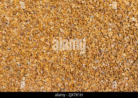 Abstrakter grauer und beiger Kiesstein-Hintergrund. Hintergrundbild mit grauen Steinen Stockfoto