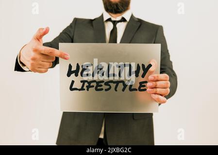 Textunterschrift: Gesundes Lifestylegesund leben körperliche Aktivität und Bewegung. Wort geschrieben auf Live Healthy sich körperlich engagieren Stockfoto