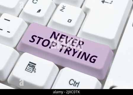 Schild mit der Anzeige Never Stop TryingDo Not Give Up Continue to Try Again Keep on doing. Wort für nicht aufgeben Weiter, erneut versuchen Machen Sie weiter Stockfoto
