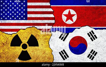 Flaggen der USA, Nordkoreas, Südkoreas und Strahlungssymbol an einer Wand. Amerika, Südkorea und Nordkorea Nuklearabkommen oder Spannungskonzept Stockfoto