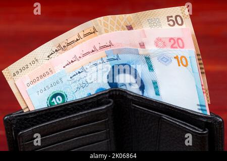 Tunesisches Geld in der schwarzen Brieftasche - neue Serie von Banknoten Stockfoto