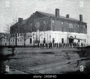 Old Capitol Prison, Washington D.C. das Old Brick Capitol in Washington, D.C. diente von 1815 bis 1819 als temporäres Capitol der Vereinigten Staaten. Das Gebäude war eine Privatschule, ein Internat und während des amerikanischen Bürgerkrieges ein Gefängnis, das als Old Capitol Prison bekannt war. Es wurde 1929 abgerissen und ist heute vom Gebäude des Obersten Gerichtshofs der USA besetzt Stockfoto