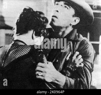 Anthony Quinn und Carolyn Jones in Last Train von Gun Hill, einem Western aus dem Jahr 1959 in VistaVision und Technicolor. Manuel Antonio Rodolfo Quinn Oaxaca (21. April 1915 - 3. Juni 2001), professionell bekannt als Anthony Quinn, war ein mexikanisch-amerikanischer Schauspieler, Maler, Schriftsteller und Regisseur. Carolyn Se Jones (28. April 1930 - 3. August 1983) war eine amerikanische Fernseh- und Filmschauspielerin. Stockfoto