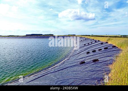 landwirtschaftlichen Reservoir, künstlichen, Versorgung mit Wasser für die Bewässerung der Landwirtschaft, Norfolk, England, UK Stockfoto