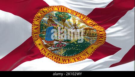 Nahaufnahme des schwingenden Stands der Florida-Flagge. Florida ist ein Bundesstaat im Südosten der Vereinigten Staaten. Texturierter Hintergrund aus Stoff Stockfoto