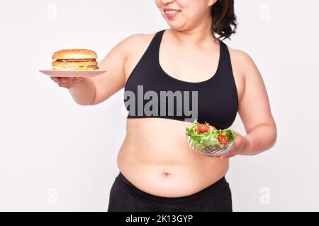 Übergewichtige japanische Frau auf einer Diät Stockfoto