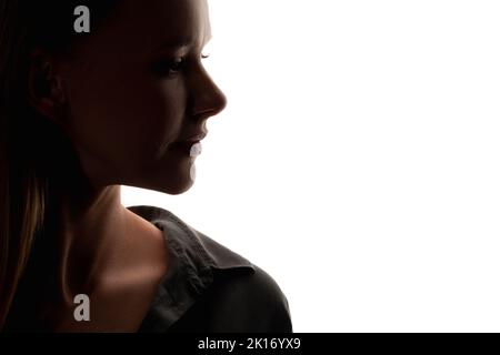 Gesichtskonturierung. Anti-Aging-Therapie. Hautverjüngung. Schönheitspflege. Profil Frau Silhouette isoliert auf weißen Kopie Raum Hintergrund. Stockfoto