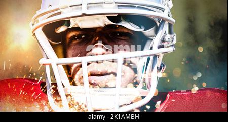American Football Spieler gegen das Spritzen von Pulver Stockfoto