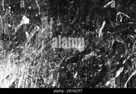 Schmutziger Grunge-Hintergrund mit abstrakten Graustufen-Punkten an der Wand Stockfoto