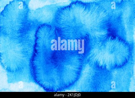 Aquarell blaue und türkisfarbene Flecken auf Papierhintergrund. Handbemalt Stockfoto