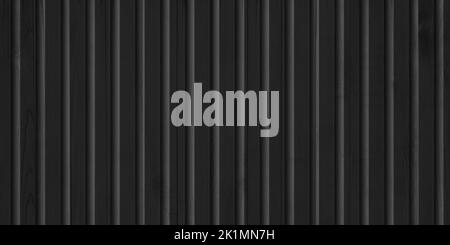Vertikale schwarze Seitenstruktur, Holz-, Kunststoff- oder Metalloberfläche eines Gebäudes oder Zauns. Wanddekoration für die Fassade. Stockfoto
