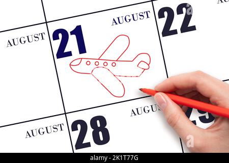 21. Tage im August. Eine Handzeichnung eines Flugzeuges am Kalenderdatum 21. August. Das Datum des Fluges im Flugzeug. Reisen, Geschäftsreisen. Sommermonat. Stockfoto