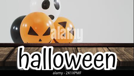 Bild von halloween Text über halloween Ballons auf Holzhintergrund Stockfoto