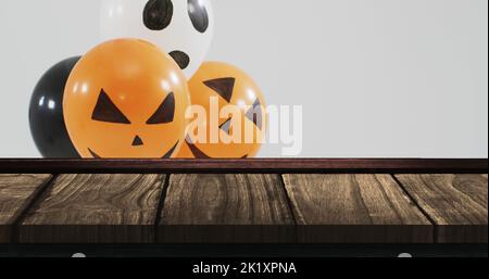 Bild von halloween Text über halloween Ballons auf Holzhintergrund Stockfoto