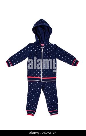 Eine modische, dunkelblaue Kapuzenpullover mit Punktmuster und eine Jeanshose für das kleine Mädchen. Sporthose und Jacke für Kinder mit Kapuze. Stockfoto