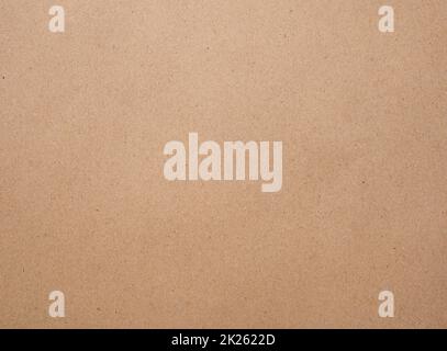 Braune Kraftpapierstruktur auf Pappblatthintergrund. Stockfoto