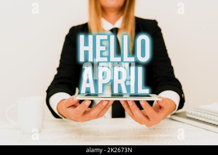 Konzeptionelle Überschrift Hallo April. Geschäftsidee ein Begrüßungsausdruck, der bei der Begrüßung des Monats April verwendet wird, in dem der App-Entwickler das neue Programm präsentiert und ein aktualisiertes Gerät anzeigt Stockfoto