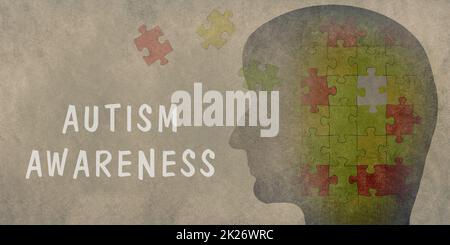 Autismus-Tag steht auf dem Hintergrund, Silhouette eines Kopfes mit Puzzle, asperges-syndrom, Psychologie Stockfoto