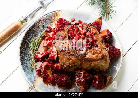 Schweinefleisch mit Granatäpfel Stockfoto
