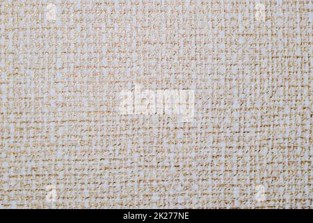 Strukturierte, weiche Tapete. Beige und Netz. Stockfoto