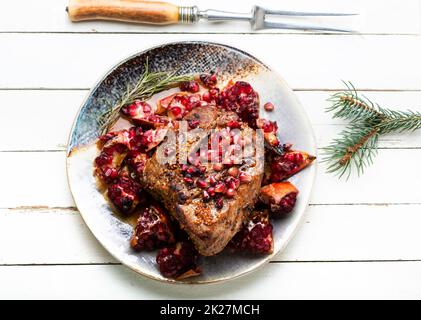 Schweinefleisch mit Granatäpfel Stockfoto