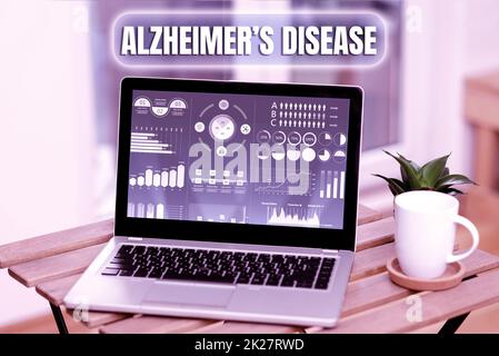 Text zeigt Inspiration Morbus Alzheimers. Geschäftsidee irreversible Gehirnerkrankung, die langsam den Speicher zerstört Laptop auf Einem Tisch neben Kaffeebecher und Pflanze zeigt Arbeitsprozess. Stockfoto