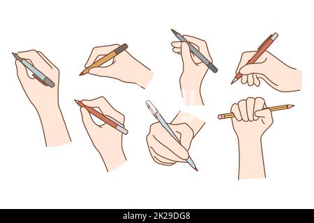 Handset mit Stiften oder Bleistiften zum Schreiben Stockfoto