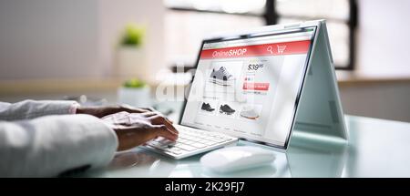 Junger Afro-Amerikanischer Mann Mit Convertible-Laptop Stockfoto