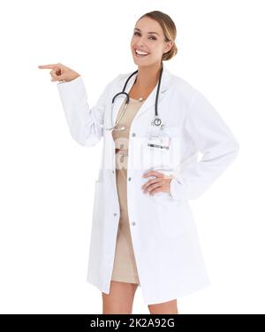 Hier ist, was Ihr Arzt empfiehlt.... Ein glücklicher Arzt, der zur Seite hin gestikuliert - Copyspace. Stockfoto