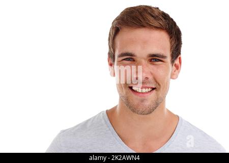 Sei du selbst, alle anderen werden getroffen. Porträt eines glücklichen jungen Mannes, der im Studio steht - isoliert auf Weiß. Stockfoto