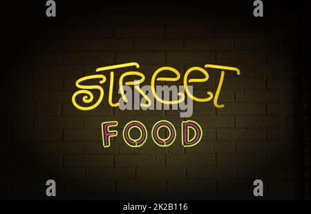 Neon Street Food Schild an der Ziegelmauer Stockfoto