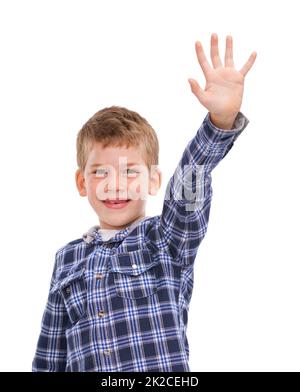 Hes wird groß werden. Studioaufnahme eines lässig gekleideten Jungen, isoliert auf Weiß und mit der Hand hochhaltend. Stockfoto