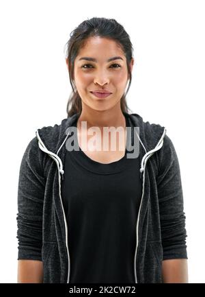 Bleiben Sie in guter Form mit täglichen Übungen. Porträt einer jungen Frau in Sportkleidung, die vor weißem Hintergrund posiert. Stockfoto