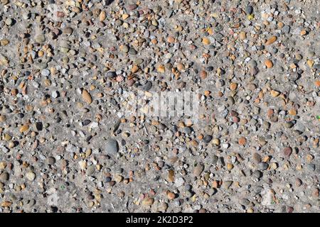 Pellets in alten Asphalt Stockfoto