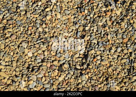 Von kleinen runden Schotter Hintergrund Stockfoto
