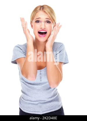 Aah, was werde ich tun? Studioportrait einer jungen Frau, die vor weißem Hintergrund Angst hat. Stockfoto