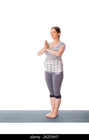 Schwanger Frau tun Yoga asana ... Stockfoto