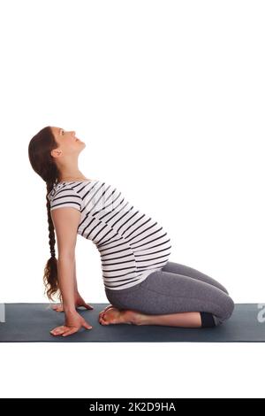 Schwanger Frau macht Yoga Asana Ustrasana Stockfoto