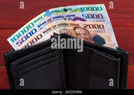 Sierra Leone Leone in der schwarzen Brieftasche Stockfoto