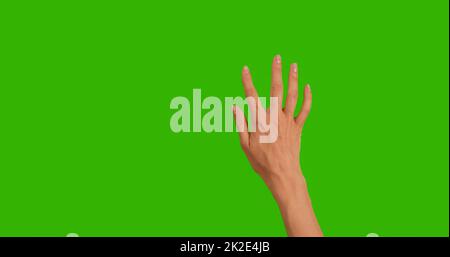 Gesten-Paket. Weibliche Hand berührt, klickt, tippt, schiebt, zieht und wischt auf dem grünen Hintergrund des Chroma Key-Bildschirms. Über ein Smartphone, einen Tablet-pc oder einen Touchscreen. Stockfoto