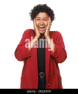 WOW. Eine schöne junge Frau mit den Händen im Gesicht überrascht. Stockfoto