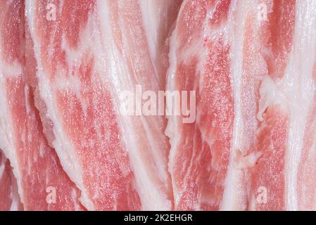 Nahpackung mit frischen Schweinefleischscheiben Stockfoto