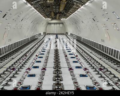 Cargo Airplane - view inside the main deck cargo compartment on a freshly converted wide-body freighter aircraft Stock Photo