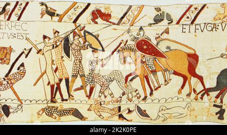 Bayeux Tapisserie 1067: Schlacht von Hastings, 14. Oktober 1066. Nach dem Tod von Harold den Normannen, zu Pferd, wischen Sie die restlichen Engländer, zu Fuß in Kettenpost. Englisch tot in der ersten Grenze, richtig, der Kleidung beraubt. Textiles Leinen Stockfoto