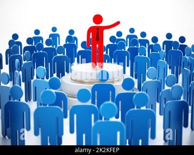 Eine öffentliche Rednerin, eine rote Figur, umgeben von blauen Figuren, die eine Rede halten Stockfoto