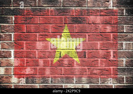 Vietnam-Flagge auf einem Backsteinmauer Hintergrund Stockfoto