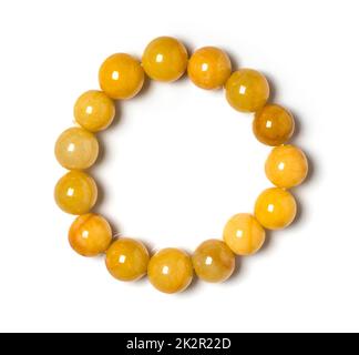 Honey Jade Schmuck oder Edelsteine Armband auf weißem Hintergrund. Kollektion von natürlichen Edelsteinen Accessoires. Studioaufnahme Stockfoto