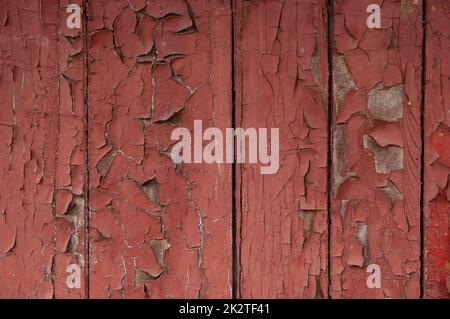 Grunge Hintergrund: Abgestreifte alte Bretter mit roter Farbe bemalt Stockfoto