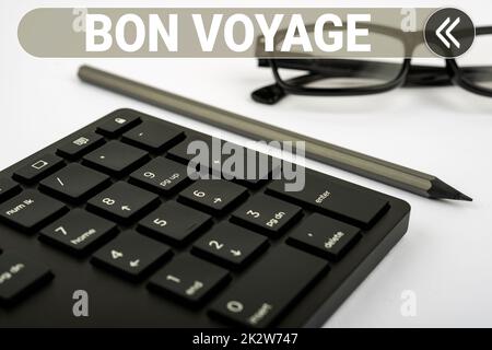 Schild mit der Aufschrift „Bon Voyage“. Ein Wort, das auf gebraucht geschrieben wurde, drückt jemandem gute Wünsche über die Start-auf-Reise-Computer-Tastatur und Symbol aus. Informationsmedium für Kommunikation. Stockfoto